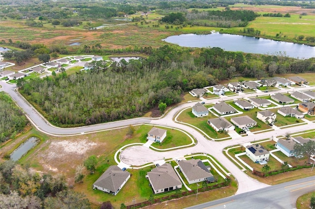 birds eye view of property with a residential view and a water view