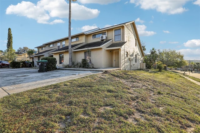 view of property with a front lawn