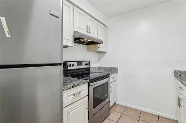 kitchen featuring white cabinetry, under cabinet range hood, light tile patterned floors, and appliances with stainless steel finishes