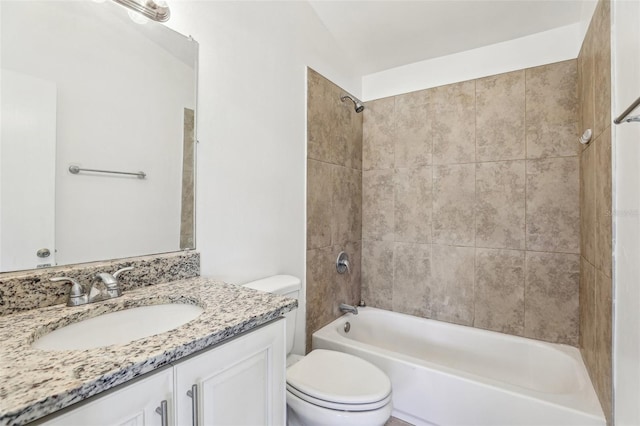 bathroom featuring shower / bathing tub combination, toilet, and vanity