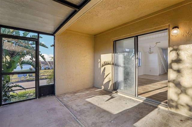 doorway to property with a patio area and stucco siding