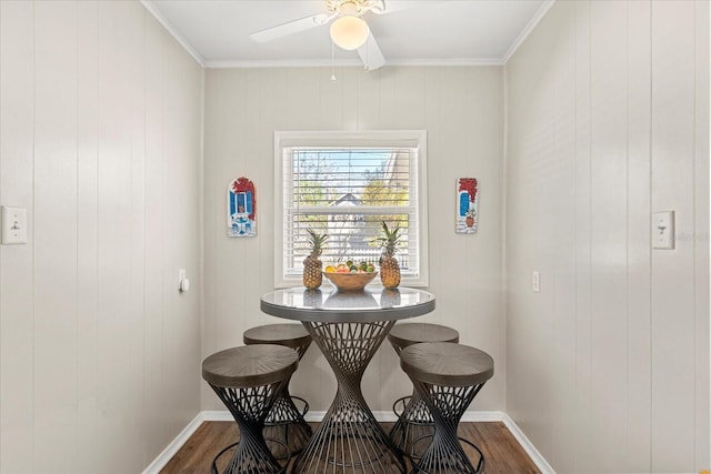 dining space with dark wood-style floors, baseboards, and ceiling fan