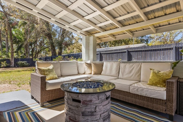 view of patio with an outdoor living space and a fenced backyard