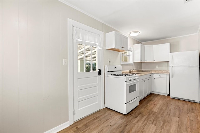 kitchen with white cabinets, white appliances, crown molding, and light wood-style floors