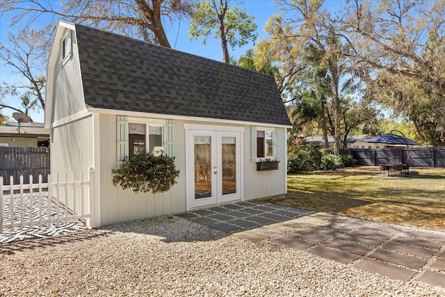 view of outbuilding with an outbuilding and fence