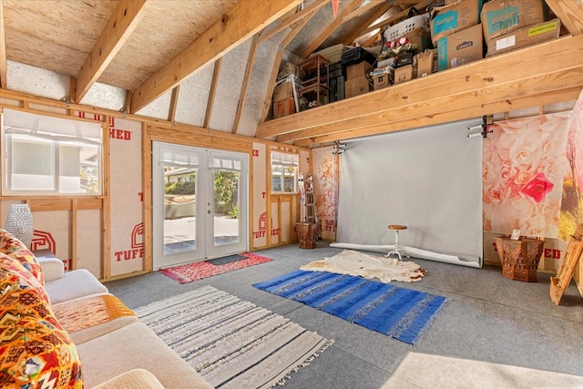 interior space featuring french doors and lofted ceiling