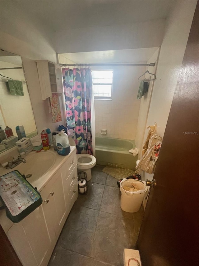 full bathroom featuring vanity, shower / tub combo, toilet, and tile patterned flooring