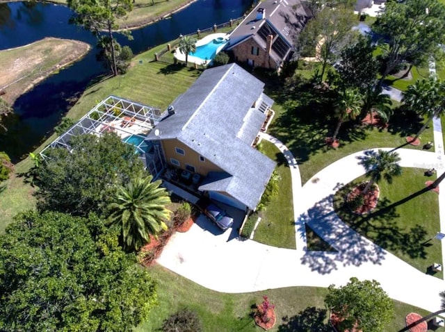 birds eye view of property with a water view