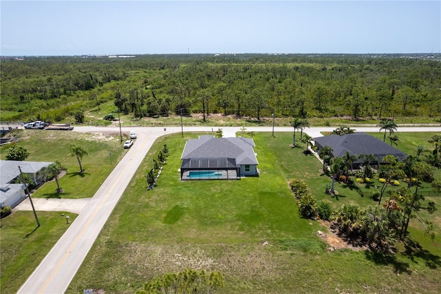 291 Rotonda Blvd S, Rotonda West, FL 33947 - aerial view of property and surrounding area with a heavily wooded area