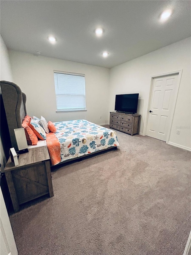 bedroom featuring recessed lighting, baseboards, and carpet