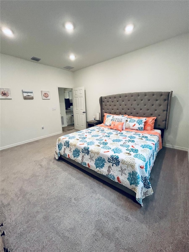 carpeted bedroom with recessed lighting, visible vents, and baseboards