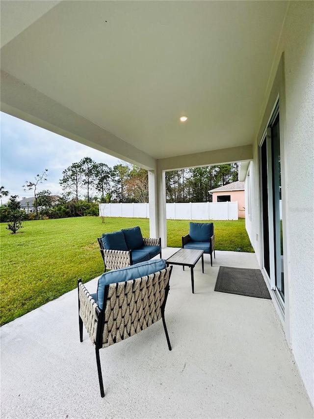 view of patio / terrace featuring fence and an outdoor hangout area
