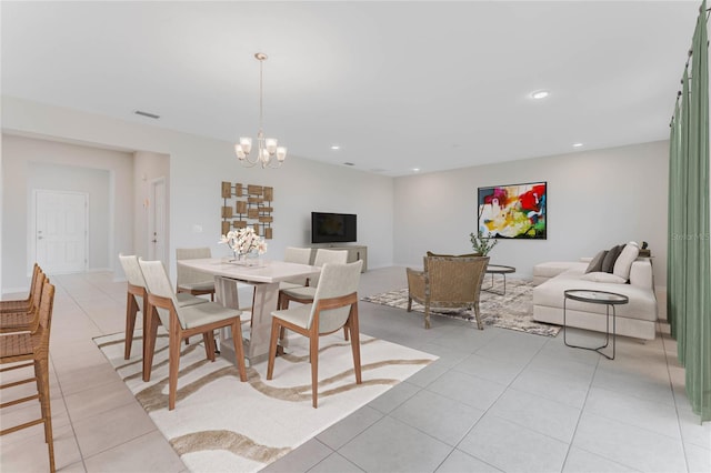 dining space featuring recessed lighting, visible vents, a notable chandelier, and light tile patterned floors