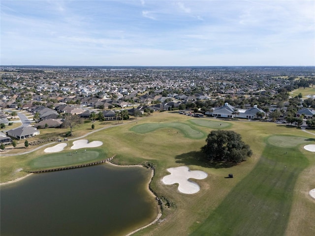 birds eye view of property featuring golf course view, a residential view, and a water view