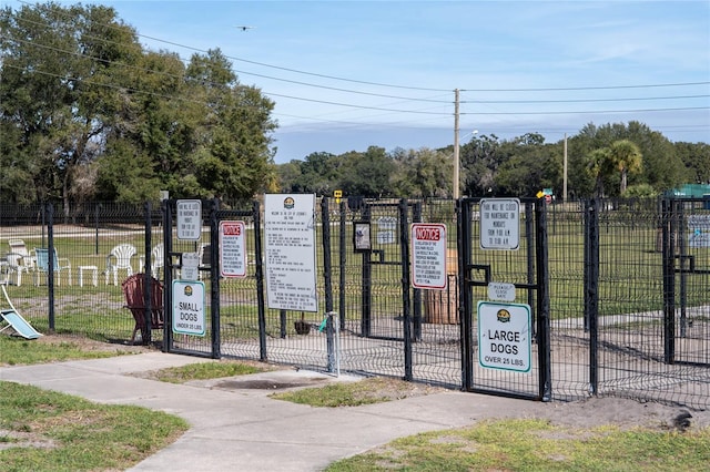 view of gate featuring fence