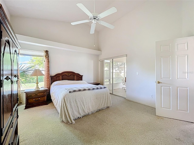 bedroom with baseboards, high vaulted ceiling, carpet, and a ceiling fan