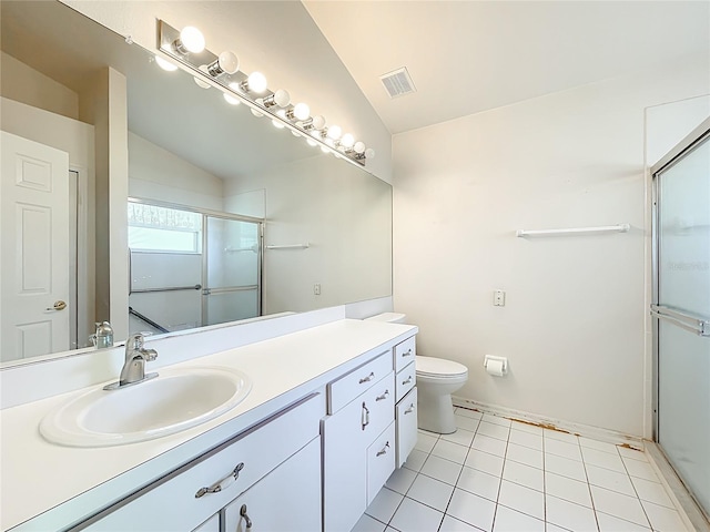 bathroom featuring tile patterned flooring, visible vents, lofted ceiling, a stall shower, and vanity