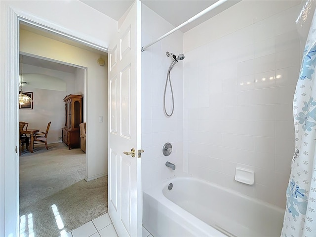 bathroom with tile patterned flooring and shower / bath combination with curtain