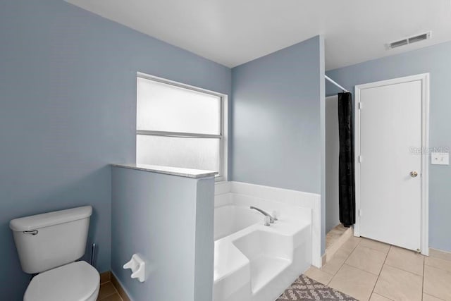 full bathroom with tile patterned flooring, visible vents, toilet, a garden tub, and a shower with curtain