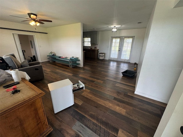 living area featuring french doors, baseboards, wood finished floors, and a ceiling fan