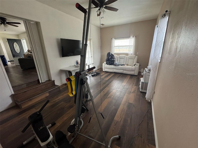 living area featuring ceiling fan and hardwood / wood-style flooring