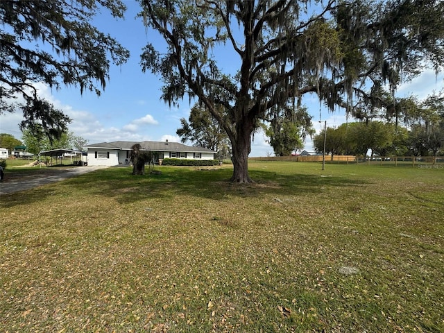 view of yard with a carport