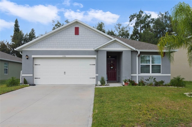 ranch-style house featuring a front lawn, concrete driveway, and stucco siding