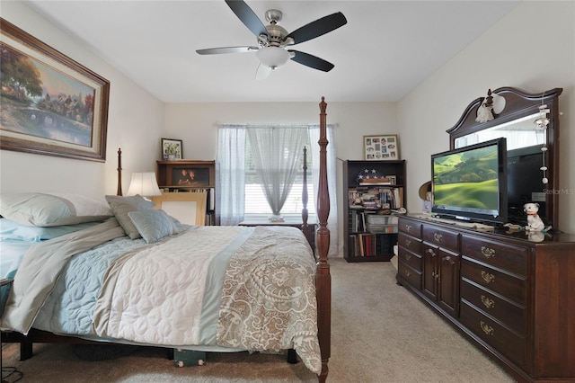 bedroom featuring light carpet and ceiling fan