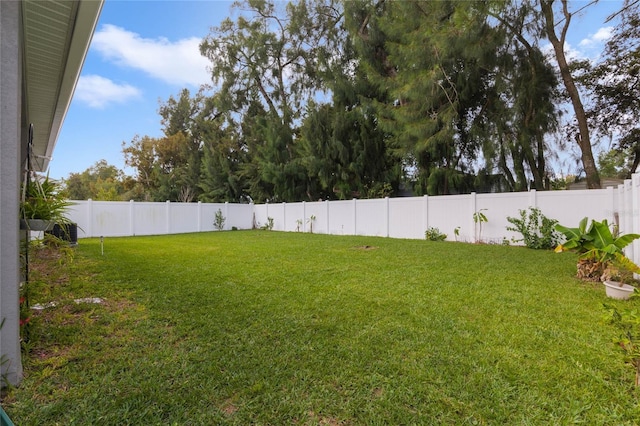 view of yard with a fenced backyard