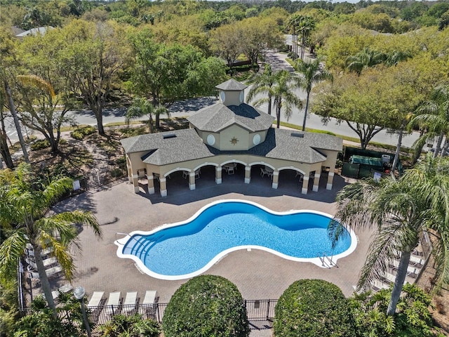 pool with fence and a patio area