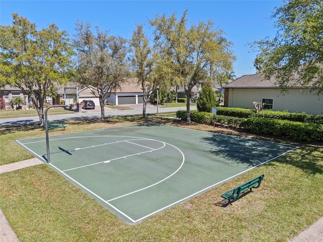 view of sport court with community basketball court and a lawn