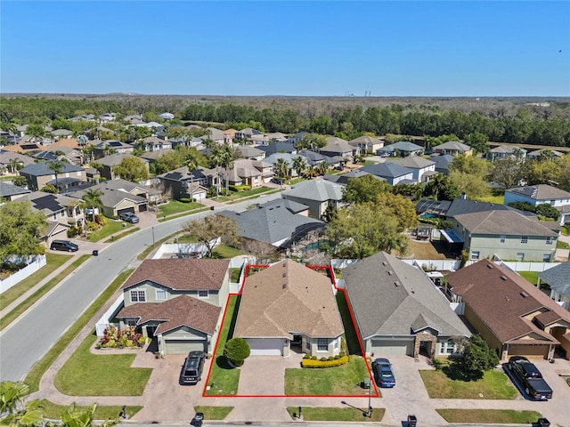 birds eye view of property with a residential view