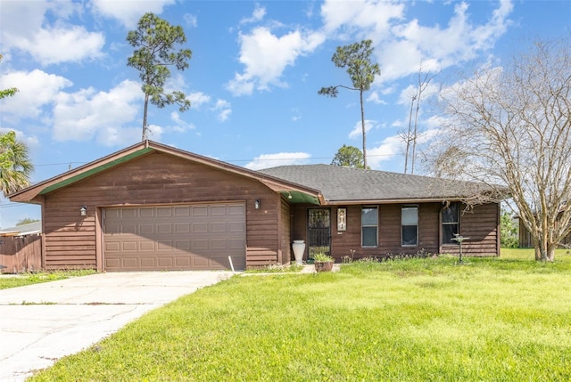 ranch-style house featuring a garage, a front yard, driveway, and a shingled roof