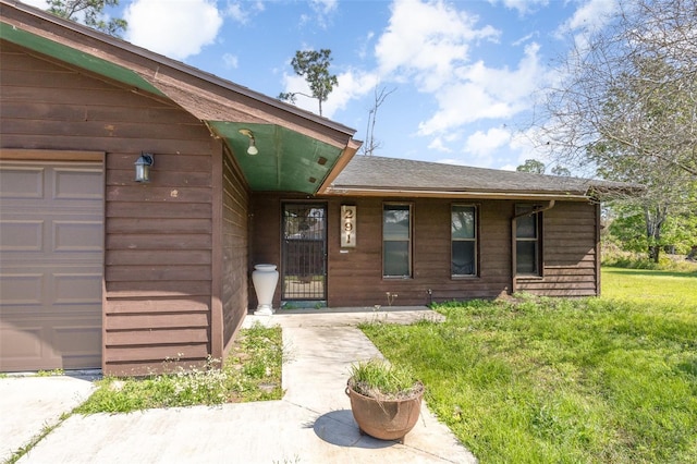 property entrance with a garage