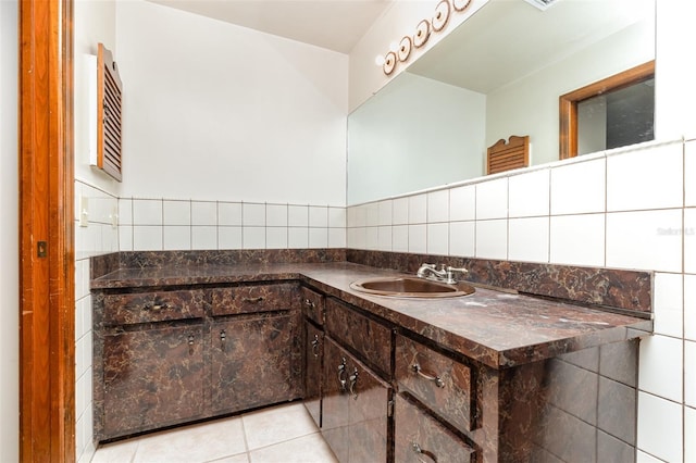 bathroom with tile patterned flooring, vanity, and tile walls