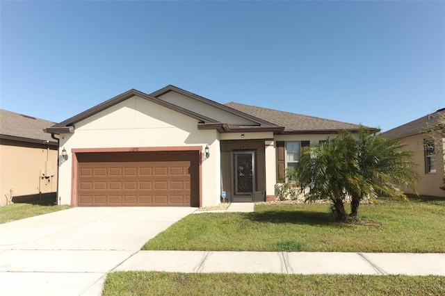 single story home featuring stucco siding, a front lawn, driveway, a shingled roof, and a garage