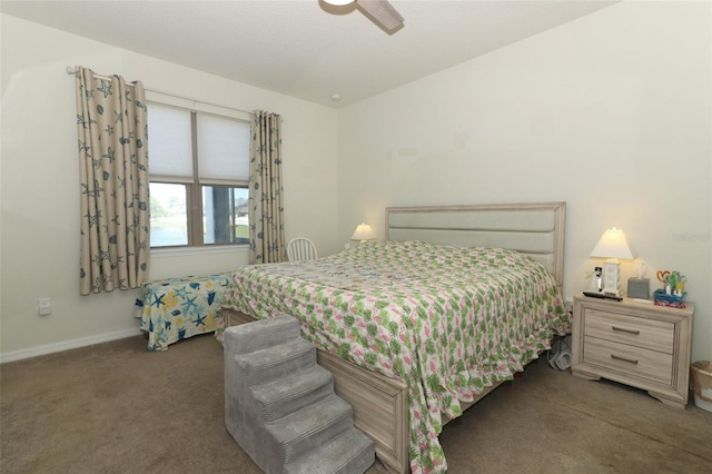 bedroom with a ceiling fan, baseboards, and carpet floors