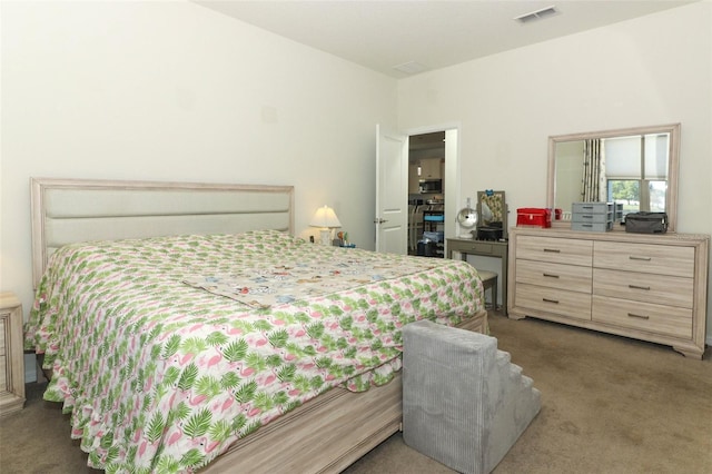 bedroom featuring visible vents and carpet floors