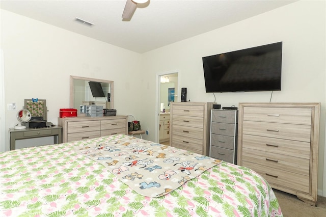 bedroom featuring visible vents, light colored carpet, and ceiling fan