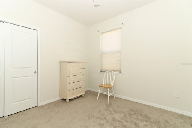 unfurnished bedroom with baseboards and light carpet