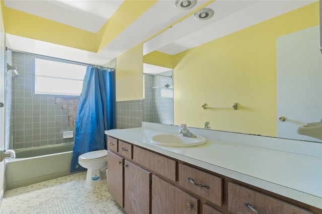 full bath with tile patterned flooring, tile walls, toilet, shower / bath combination with curtain, and vanity