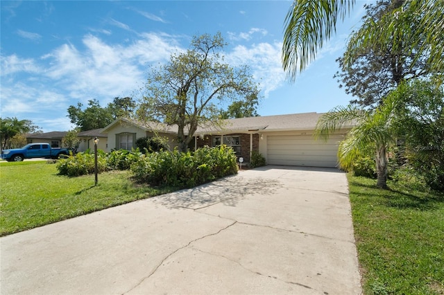 ranch-style home featuring brick siding, a front yard, concrete driveway, and an attached garage