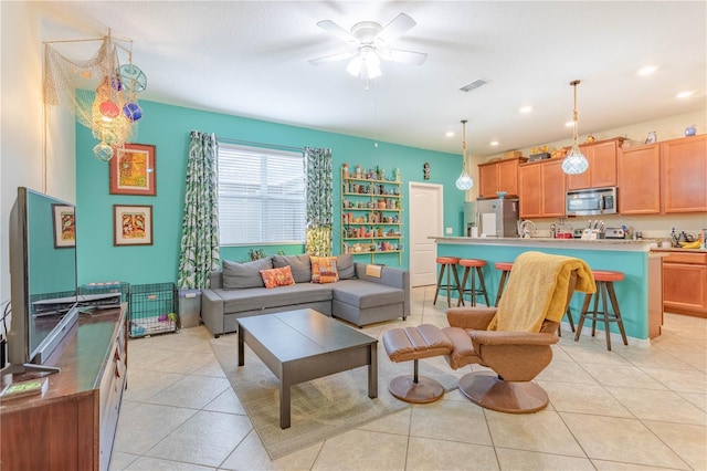 living area with recessed lighting, light tile patterned floors, a ceiling fan, and visible vents