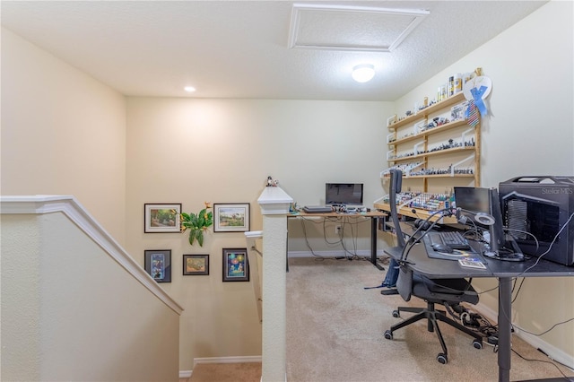 office featuring attic access, light colored carpet, and baseboards