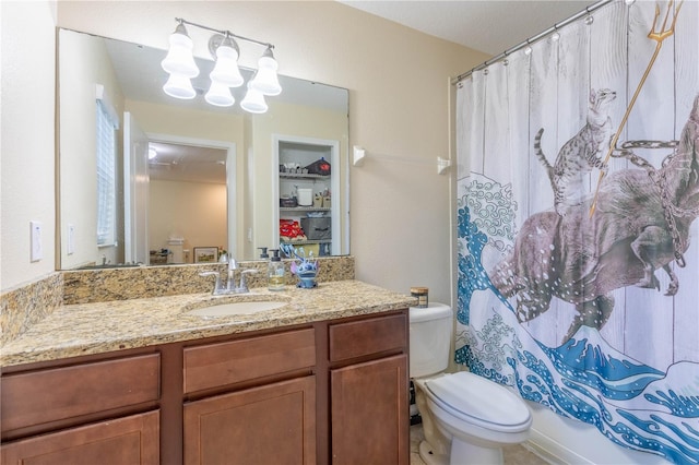 bathroom featuring a shower with curtain, toilet, and vanity