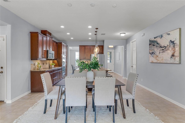 dining room with visible vents, light tile patterned flooring, recessed lighting, and baseboards