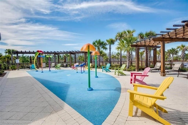 view of playground featuring a patio, fence, and a pergola