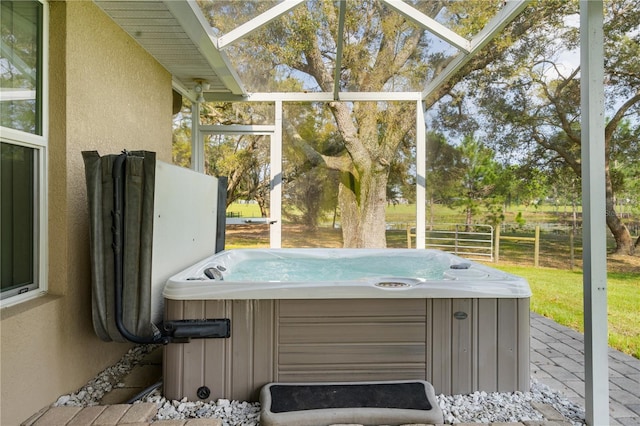 sunroom with a hot tub