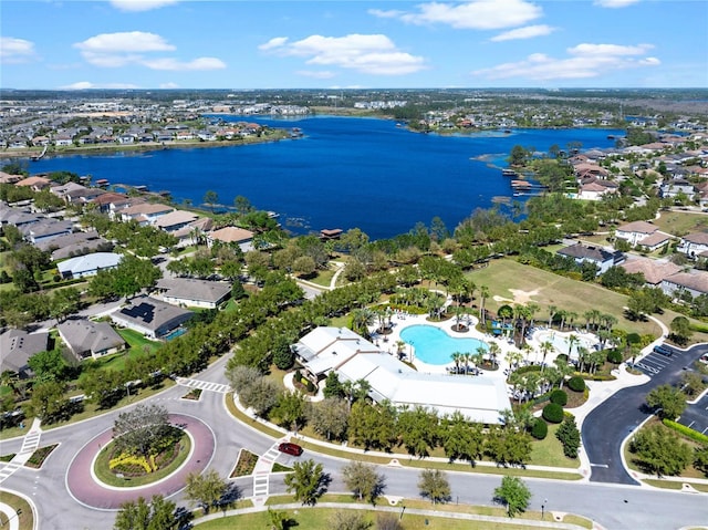 birds eye view of property featuring a water view and a residential view