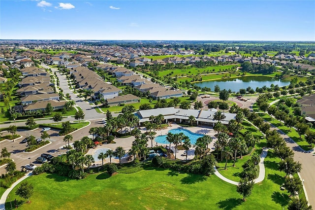 birds eye view of property with a residential view and a water view